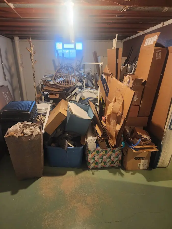 Roll-off dumpster container at job site for 2 Yard Dumpster Rental in Hibbing